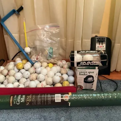 Golf Items Including Balls, Tees, A Sweet Spot Finder, And More
