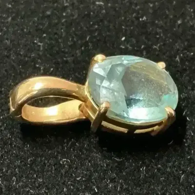 14k Gold Blue Topaz Pendant (2.53 Grams Total)