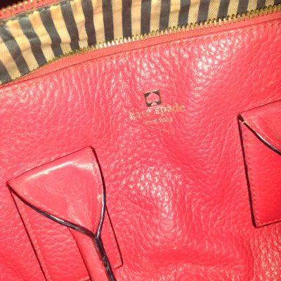 Sale Photo Thumbnail #945: Pair of Kate Spade New York Purses.  Items are in used condition with wear and need cleaning.