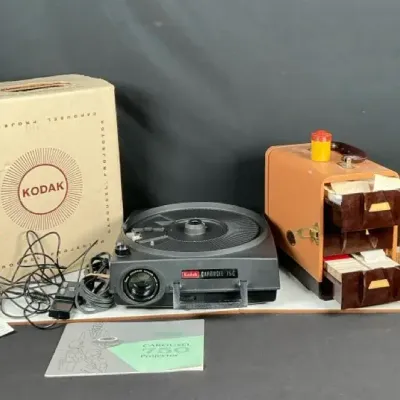 Sale Photo Thumbnail #111: Kodak Carousel 750 Slide Projector with Carrying Case, Slides, Manual & Box