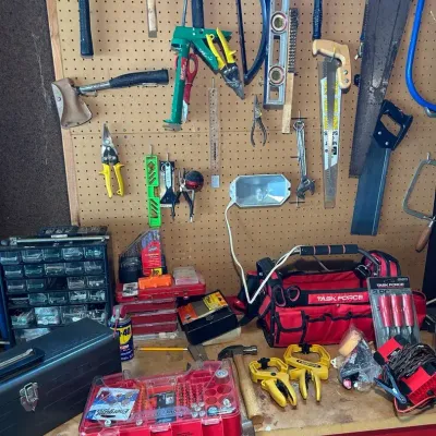 Tools and Contents on Workbench and Pegboard 
