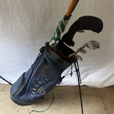 Nike Golf Bag & Random Assortment of Golf Clubs 