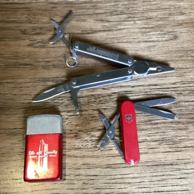 A Red Metal Promotional Lighter And Swiss Army Knife, Vintage Leather man pST Multi-tool With Pliers