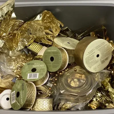 A Collection Of Assorted Gold And Silver Colored Ribbon And Embellishment