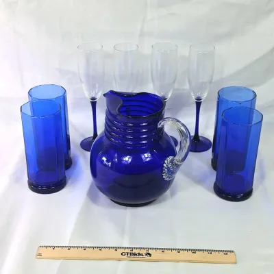 Sale Photo Thumbnail #63: Cobalt Blue Glass Including Anchor Hocking Cups, Neptune Luminarc Wine Flutes, And Pitcher