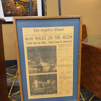 Framed newspaper
Man walks on moon