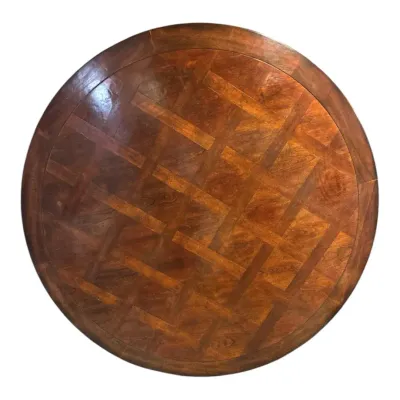 walnut and burl wood dining table features an intricate geometric parquet tabletop