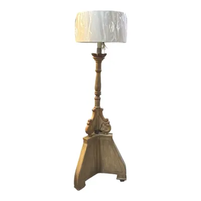 Ornate, antique-style wooden floor lamp featuring a classical candlestick base 