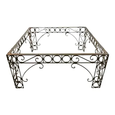 Metal base with scroll design for a coffee table 