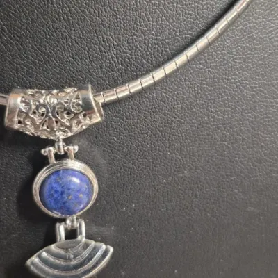 Sale Photo Thumbnail #29: Lapis Lazuli Pendant 925 sterling snake chain & Dangle Earrings
Necklace is 16" w/ lobster claw, Pendant has filigree scroll bail.
Pendant has a Deco design