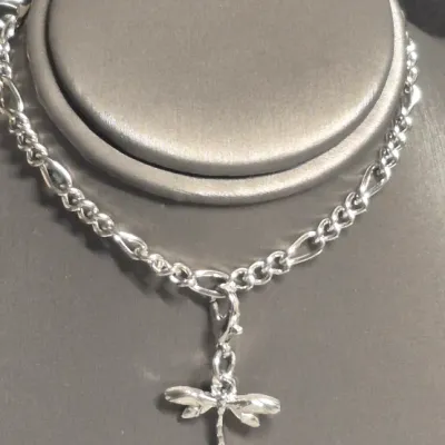 Sale Photo Thumbnail #34: Men's Silver cuff Bracelet & Woman's link chain Bracelet with bird charm
> Men's is 8" and is without scratches or damage
> Woman's link chain has a bird charm on lobster claw so it can be worn or not.
Both are new as found