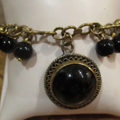 Vintage Bracelet Black Glass Cabochons w/dangling black beads Brass Tone Chain
