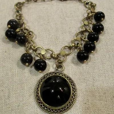 Vintage Bracelet Black Glass Cabochons w/dangling black beads Brass Tone Chain