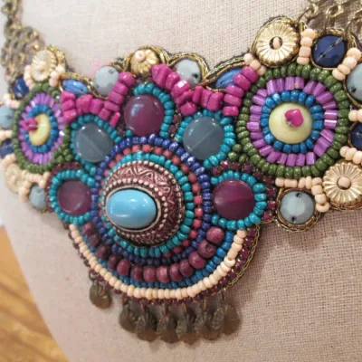 handcrafted bib necklace intricate bead embroidery metallic turquoise accent