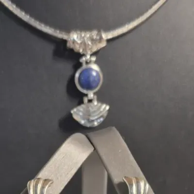 Sale Photo Thumbnail #28: Lapis Lazuli Pendant 925 sterling snake chain & Dangle Earrings
Necklace is 16" w/ lobster claw, Pendant has filigree scroll bail.
Pendant has a Deco design