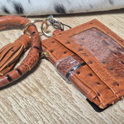 Sale Photo Thumbnail #7: Tumbleweed trail fringed had tooled Crossbody bag by MYRA BAG
Myra Hand Tooled leather Handbag Features
Premium Hairon Leather

Classy Handtooled Pattern

Convenient Phone Compartment

Zipper-close top

Trendy Fringe Accents

Myra Tooled Handbags Dimensio