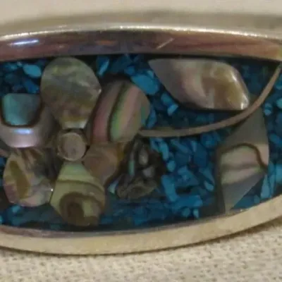 Sale Photo Thumbnail #236: Alpaca Mexico silver with turquoise and mother of pearl inlay flower designer bangle bracelet - signed.
excellent condition