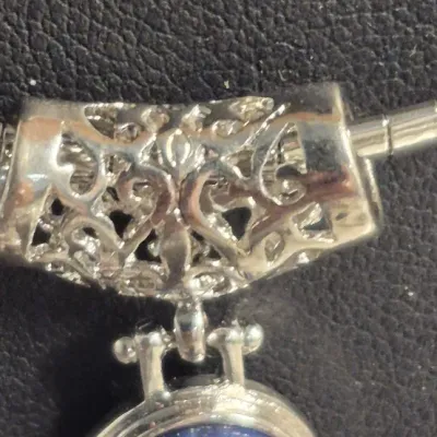 Sale Photo Thumbnail #31: Lapis Lazuli Pendant 925 sterling snake chain & Dangle Earrings
Necklace is 16" w/ lobster claw, Pendant has filigree scroll bail.
Pendant has a Deco design