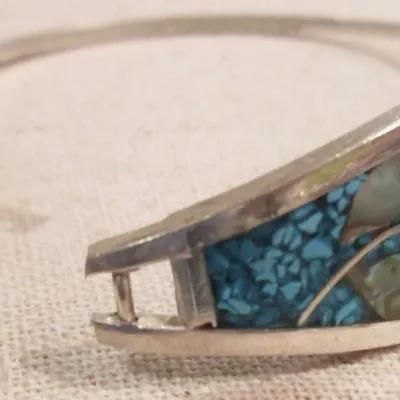 Sale Photo Thumbnail #237: Alpaca Mexico silver with turquoise and mother of pearl inlay flower designer bangle bracelet - signed.
excellent condition