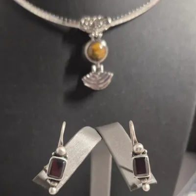 Sale Photo Thumbnail #41: Sterling tested Pendant on snake bar necklace & Sterling Earrings match
> Pendant has filigree bail and tiger eye cabochon Deco style.....test positive for sterling
> Earrings are tiger eye , marked sterling on sides
both in excellent condition