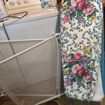 Ironing board and clothing racks