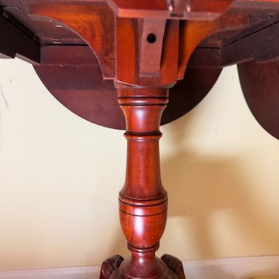 LOT 64: Wooden 4-Sided Drop Cloverleaf Pedestal Table, Floor Lamp and Floral Wall Art