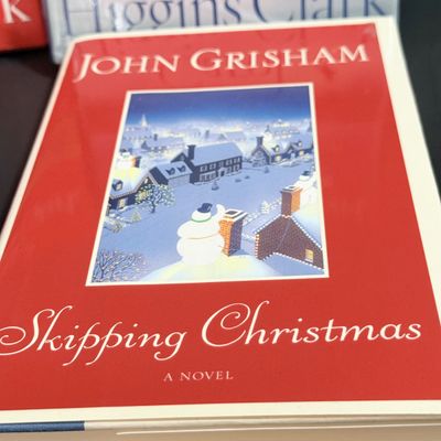 LOT 24: Holiday Novels by Mary Higgens Clark and John Grisham, Nativity Set In Original Box, Metal Church Candle Holder and More