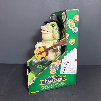 LOT 79: Vintage Dan Dee Animatronic Frog "The Gambler" in Original Box, Spidewick Childrens Book. Poker Chips, Cards and Hand...