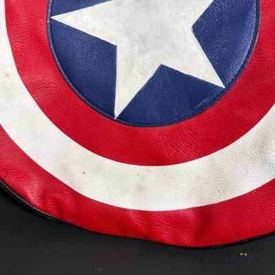 LOT 76: Marvels Captain America Shield Backpack with Wonder Woman Costume (Cape, Shirt and Headband Only)