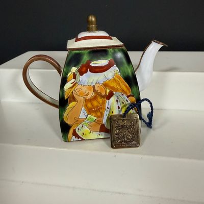 LOT 75: Collection of Miniature Enamel Teapots by Kelvin Chen, Mini Glass Flower Teapot Paperweights, Lenox Shell Shaped Dish & More