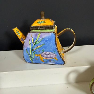 LOT 75: Collection of Miniature Enamel Teapots by Kelvin Chen, Mini Glass Flower Teapot Paperweights, Lenox Shell Shaped Dish & More