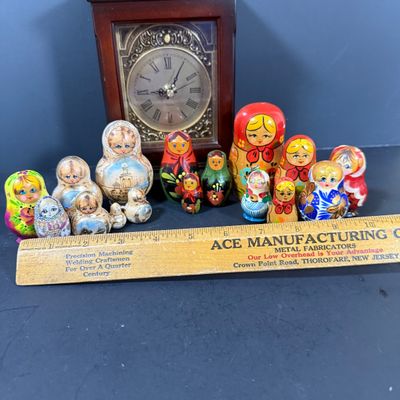 LOT: 72: Collection of Russian Style Nesting Dolls and Quartz Bombay Co Mantle Clock