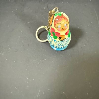 LOT: 72: Collection of Russian Style Nesting Dolls and Quartz Bombay Co Mantle Clock