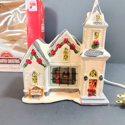 LOT 24: Holiday Novels by Mary Higgens Clark and John Grisham, Nativity Set In Original Box, Metal Church Candle Holder and More