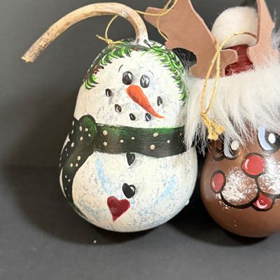 LOT 20: Collection of Festive Snowmen and Other Holiday Decor Including Painted Gourds and a Glass Frog Santa