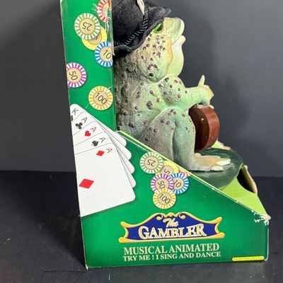 LOT 79: Vintage Dan Dee Animatronic Frog "The Gambler" in Original Box, Spidewick Childrens Book. Poker Chips, Cards and Hand...