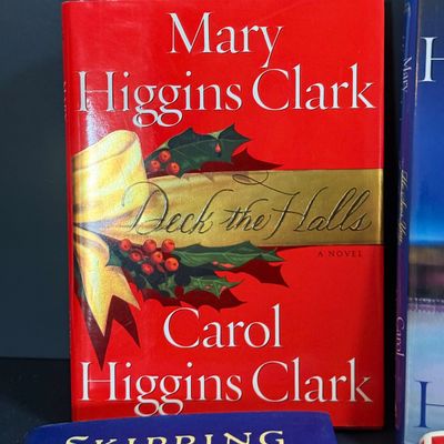 LOT 24: Holiday Novels by Mary Higgens Clark and John Grisham, Nativity Set In Original Box, Metal Church Candle Holder and More