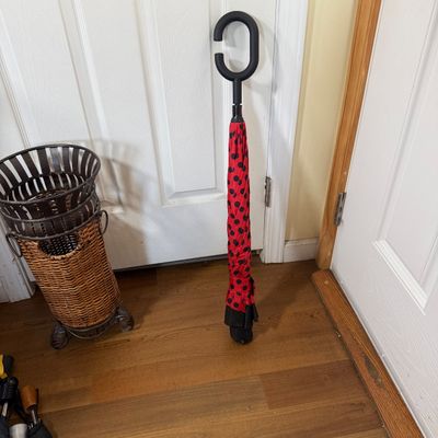 LOT 163: Metal and Wicker Umbrella Stand with Umbrellas