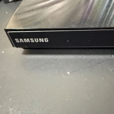 LOT 73: Samsung Blu-Ray Player BD-EM59C with a Large Selection of DVDs and 2 Blu-Rays - Including Unopened DVDs