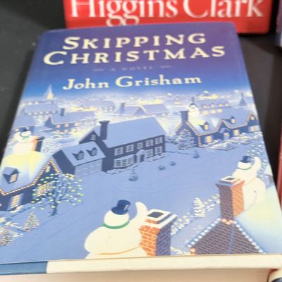 LOT 24: Holiday Novels by Mary Higgens Clark and John Grisham, Nativity Set In Original Box, Metal Church Candle Holder and More