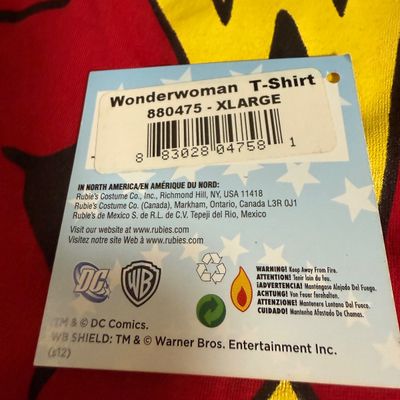 LOT 76: Marvels Captain America Shield Backpack with Wonder Woman Costume (Cape, Shirt and Headband Only)