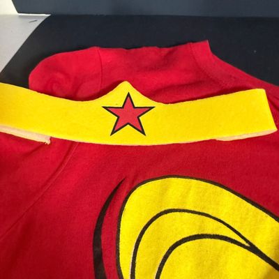 LOT 76: Marvels Captain America Shield Backpack with Wonder Woman Costume (Cape, Shirt and Headband Only)