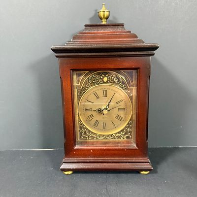 LOT: 72: Collection of Russian Style Nesting Dolls and Quartz Bombay Co Mantle Clock