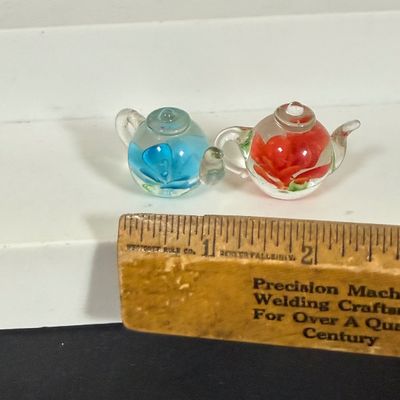 LOT 75: Collection of Miniature Enamel Teapots by Kelvin Chen, Mini Glass Flower Teapot Paperweights, Lenox Shell Shaped Dish & More