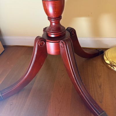 LOT 64: Wooden 4-Sided Drop Cloverleaf Pedestal Table, Floor Lamp and Floral Wall Art