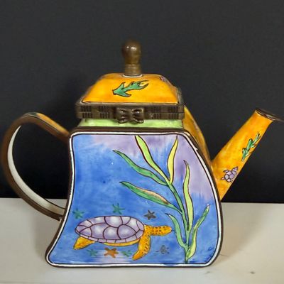 LOT 75: Collection of Miniature Enamel Teapots by Kelvin Chen, Mini Glass Flower Teapot Paperweights, Lenox Shell Shaped Dish & More