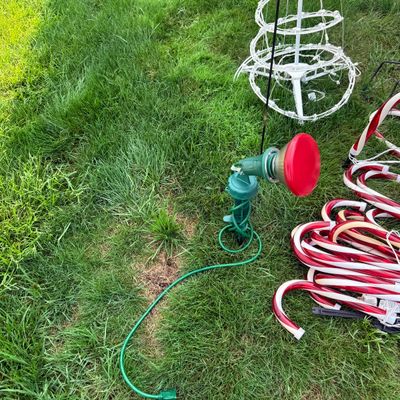 LOT 63: Assortment of Christmas Lawn Decorations Including Rope Light Christmas Trees, Candy Cane Lights. Snowflake Wind Spinner, Red...