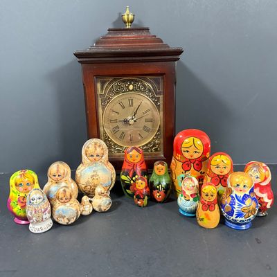 LOT: 72: Collection of Russian Style Nesting Dolls and Quartz Bombay Co Mantle Clock