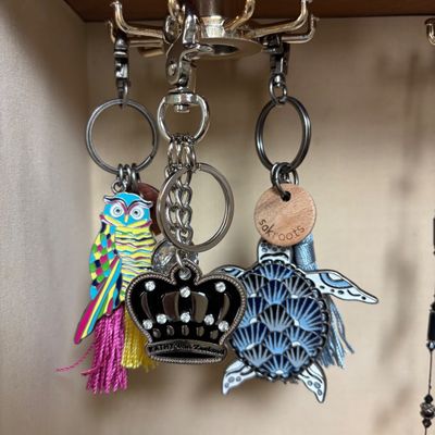 LOT 142: Jewelry Box, Sakroots Key Chains/Purse Charms & More
