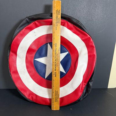 LOT 76: Marvels Captain America Shield Backpack with Wonder Woman Costume (Cape, Shirt and Headband Only)